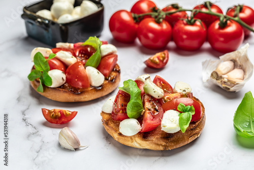 Healthy Grilled Basil Mozzarella Caprese Panini Sandwich on a light background. Delicious breakfast or snack, Clean eating, dieting, vegan food concept. top view