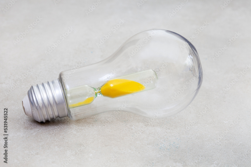 Lightbulb with hourglass, South Africa running out of time with power crisis Lightbulb with hourglass, South Africa running out of time with power crisis