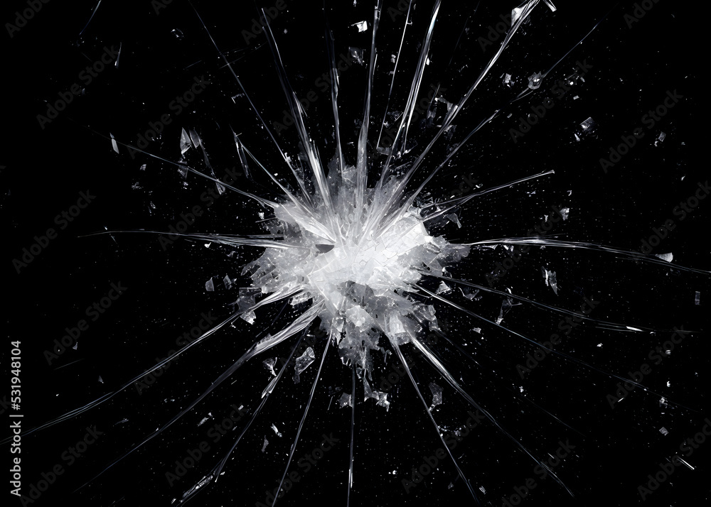 A broken glass on a deep black background, a big wide hole at the center (white shards), surrounded by large pieces. Useful texture for overlays.
