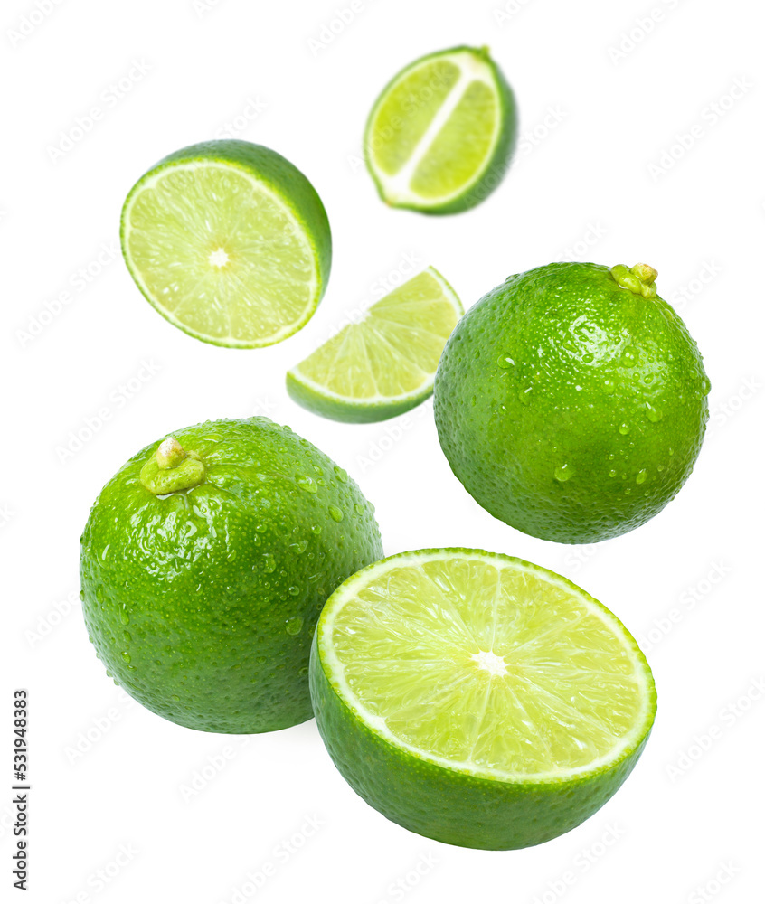 Lime with cut half sliced levitate isolated on white background. Lime with cut half sliced levitate isolated on white background.