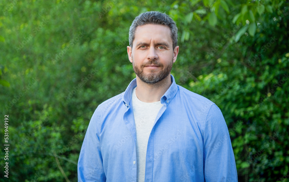 Portrait of handsome professional man in blue shirt natural background Portrait of handsome professional man in blue shirt natural background