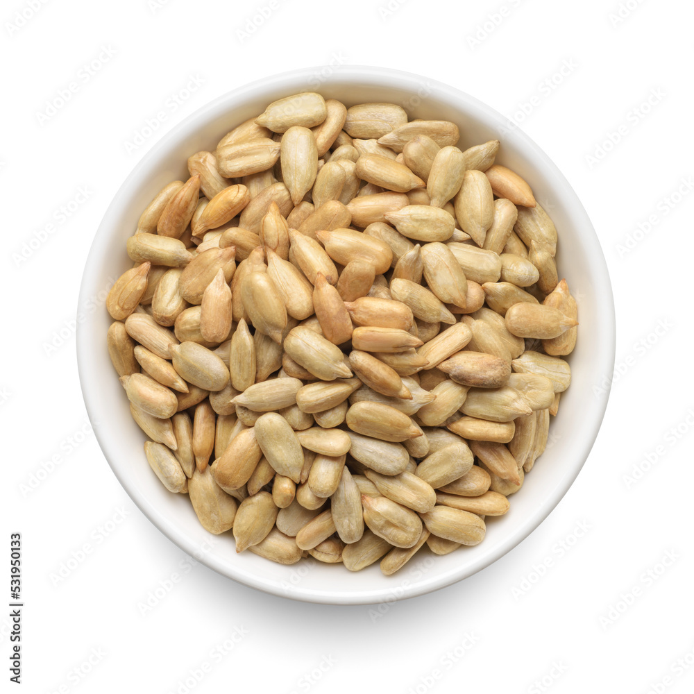 Peeled sunflower seeds in white bowl isolated on white. Top view.