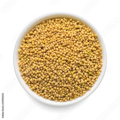 Mustard seeds in white bowl isolated on white. Top view.