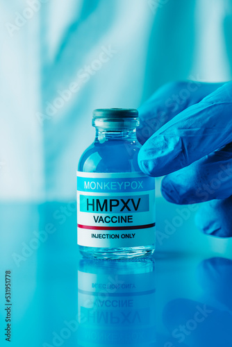 healthcare worker shows vial of monkeypox vaccine