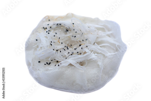 Thai traditional dessert,  soft white bun pancake, or Kanom Thung Thong in Thai, Topping with sliced coconut meat and sesames  isolated on white background. Popular street food in Thailand.    photo