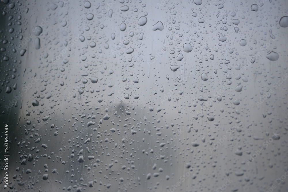 background of a light gray iron shiny sheet of iron, after the rain with dew drops, after the rain, the texture of water drops on a steel sheet with a shadow background of a light gray iron shiny sheet of iron, after the rain with dew drops, after the rain, the texture of water drops on a steel sheet with a shadow