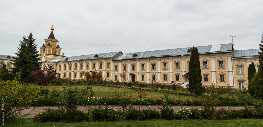 DZERZHINSK, RUSSIA - October 2019: Nikolo-Ugreshsky monastery in autumn. Yellow buildings for monks. Moscow region, Russia