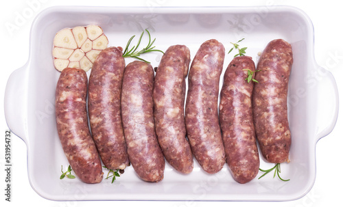 Raw beef or pork grill sausage in baking dish isolated