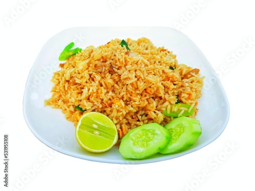 Fried rice, beautifully decorated plate isolated on a white background.