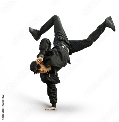Foto Fashion handsome man dancer with stylish baseball cap and sunglasses in a fashionable black outfit with a bomber jacket, jeans and sneakers performs and stands on hand