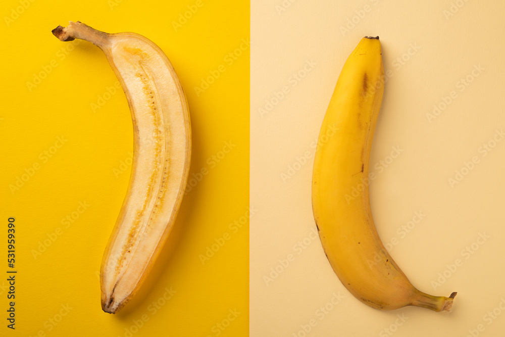 Sliced ripe banana on a bright abstract background. Flat composition. Sliced ripe banana on a bright abstract background. Flat composition.