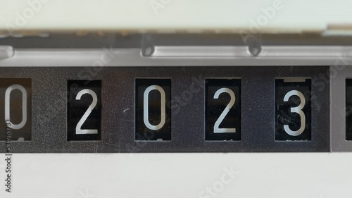 New year 2023 on a mechanical counter of gas meter photo
