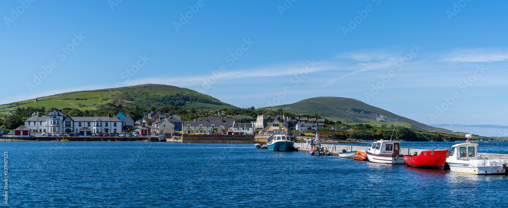 colorful boats anchored in the harbor and sports marina of Knight's Town on Valentia Island in County Kerry of western Ireland
