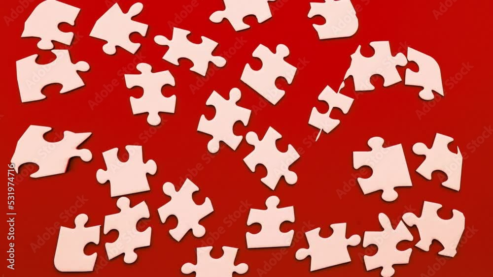 Cinemagraph of moving white puzzle on red background
Cinemagraph of moving white puzzle on red background