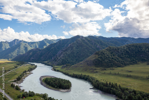 Colorful view of the mountains and the Katun River, with an island in the Altai Mountains, Siberia, Russia. View from the observation deck in the mountains. The concept of recreation and tourism