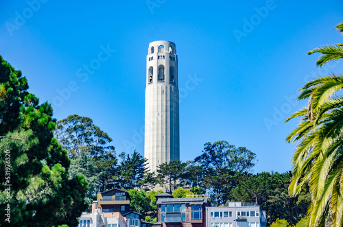 Obraz na płótnie The Coit Tower, a white circular tower in San Francisco, California pictured against a clear blue sky