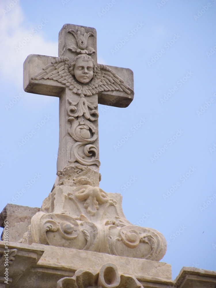 stone cross on a cemetery