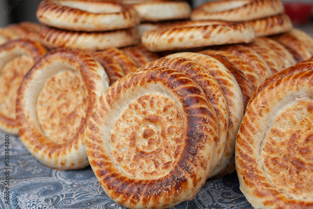 Typical traditional flatbread with crunchy crust with sesam just baked