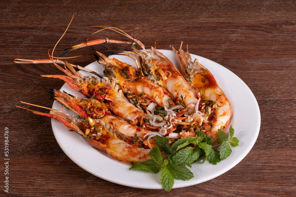 Roasted big river shrimp on the white plate Roasted big river shrimp on the white plate