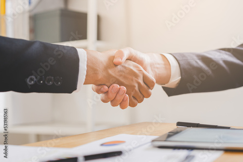 Support, business people, happy asian young man in suit, making handshake, shake hand together with partnership, customer or colleague after is done, successful. Worker meeting, congrats merger.