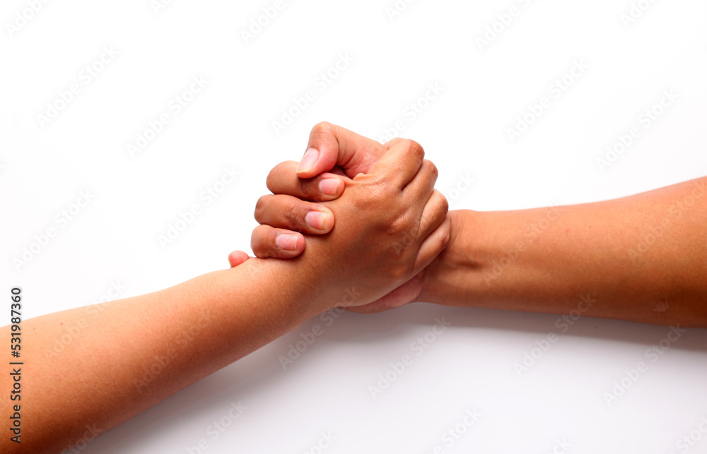 Two male hands holding each other. Concept of human relation, community, togetherness, symbolism, helping Two male hands holding each other. Concept of human relation, community, togetherness, symbolism, helping