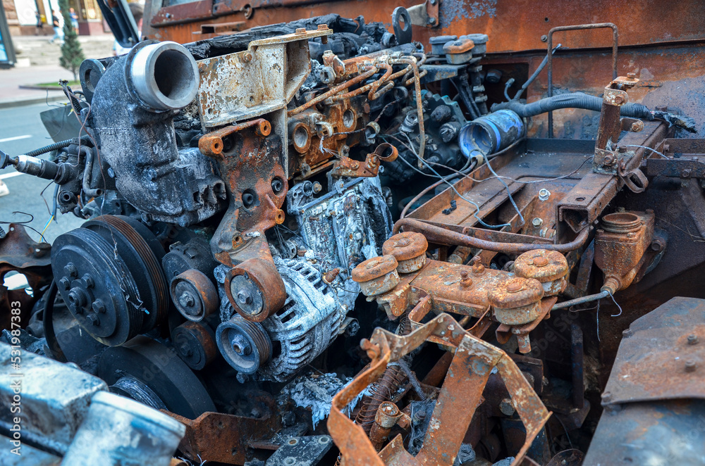 Close-up of burnt rusty engine in russian military vehicle after combat strike Close-up of burnt rusty engine in russian military vehicle after combat strike