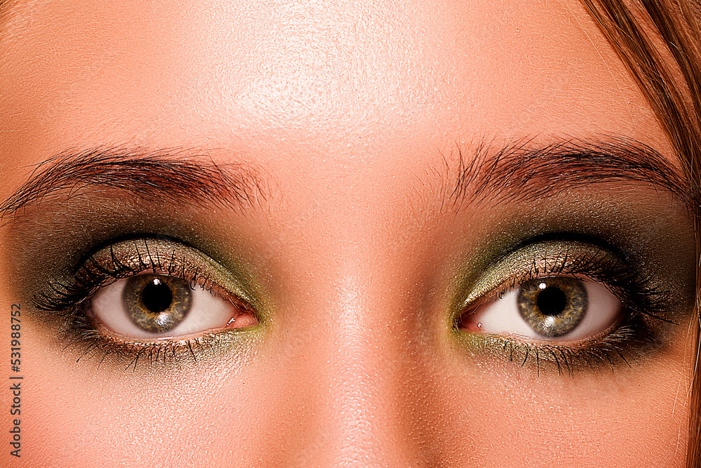 Naklejka premium Macro Green Girl Eyes with Green Eyeshadow