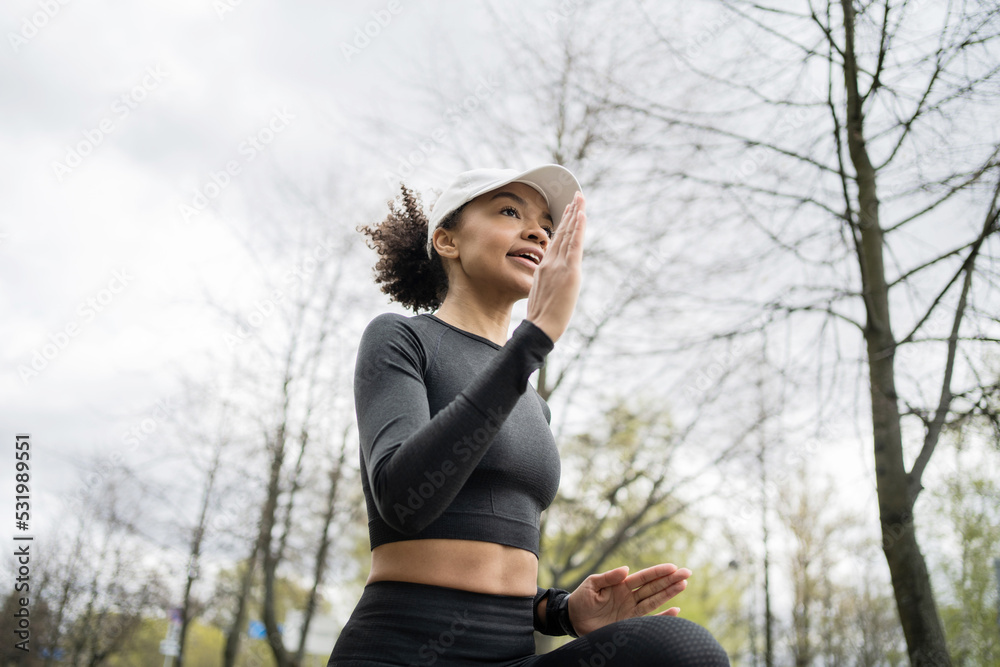 A female runner is running fitness training in a tight-fitting tracksuit. A female runner is running fitness training in a tight-fitting tracksuit.