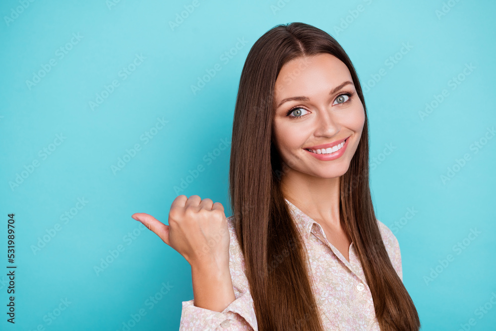 Photo of pretty positive lady bright shiny grin arm direct empty space offer proposition beauty procedure isolated on cyan color background Photo of pretty positive lady bright shiny grin arm direct empty space offer proposition beauty procedure isolated on cyan color background