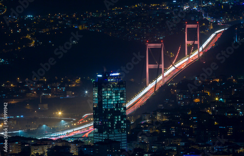 Istanbul City Night Aerial Image, Skyscrapers and Bosphorus Bridge photo