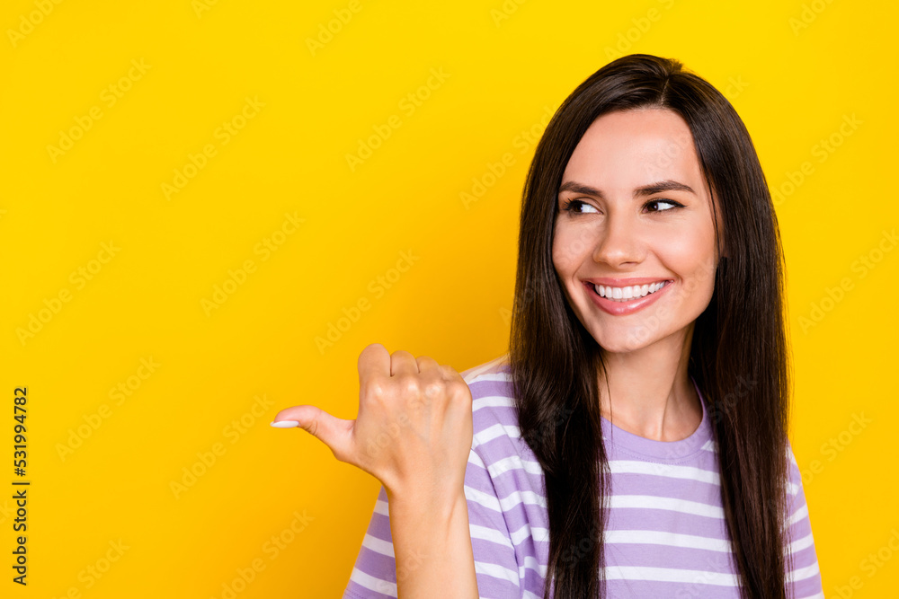 Closeup photo of young attractive gorgeous girl recommend finger pointing empty space new dentistry isolated on yellow color background Closeup photo of young attractive gorgeous girl recommend finger pointing empty space new dentistry isolated on yellow color background