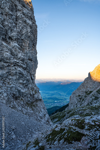 Sunrise on the top of the mountain with a view over the valley