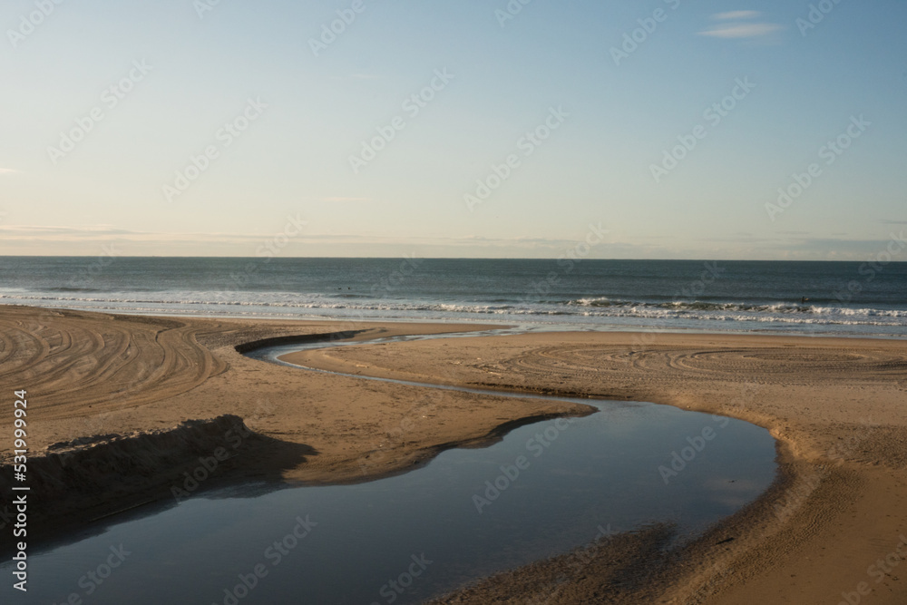 A beautiful shot of the sandy shore in the Atlantic ocean