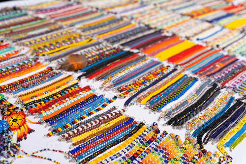 Colorful huichol thin bracelets at Chapala market in Guadalajara, Mexico. Traditional Mexican handmade souvenirs