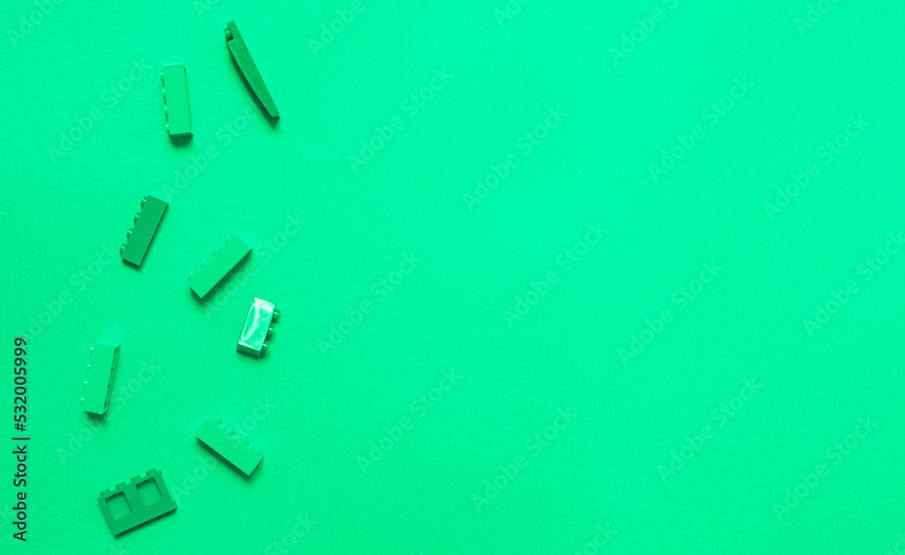 Constructor children plastic on a pastel green Constructor children plastic on a pastel green
