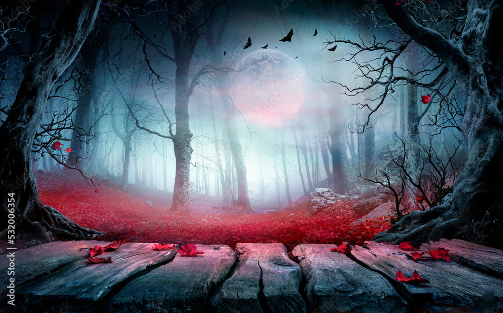 Halloween - Wooden Table In Spooky Forest At Night With Red Leaves In Autumn Landscape At Moonlight - obrazy, fototapety, plakaty 