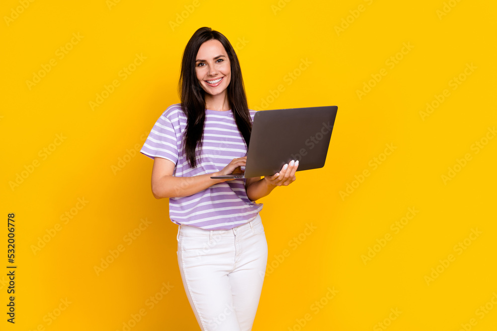 Photo of pretty sweet cute lady arm hold modern gadget enjoy quality touch keyboard empty space isolated on yellow color background