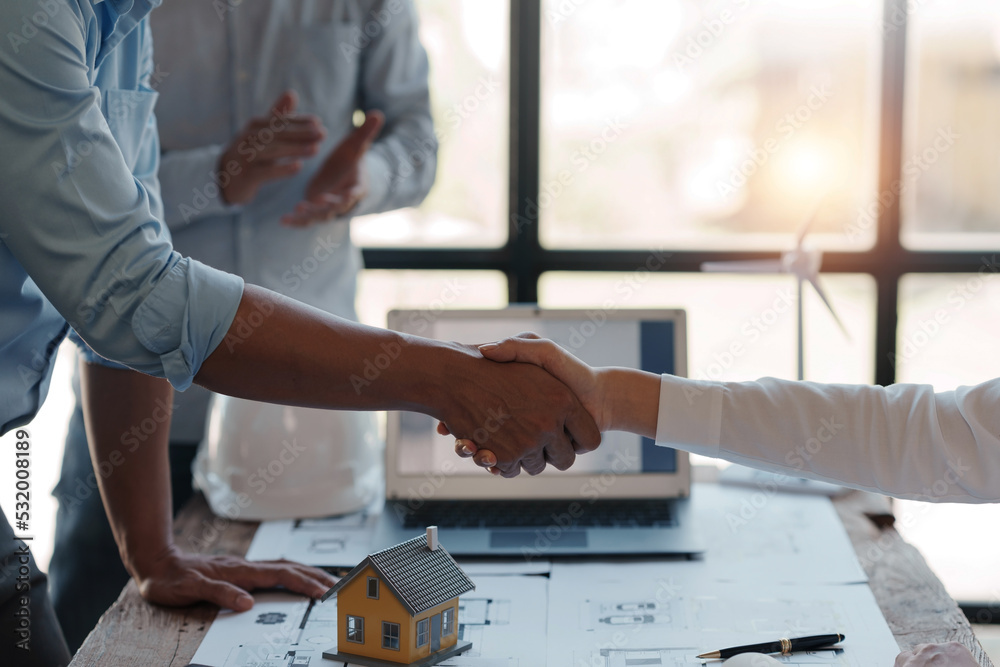 Architect and engineer work together and shaking hands to welcome home design projects to work in the same way and work together as a team. Architect and engineer work together and shaking hands to welcome home design projects to work in the same way and work together as a team.