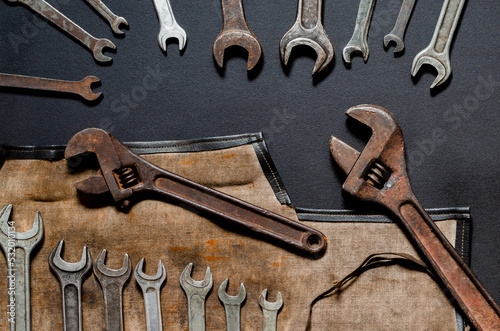 Vintage tool kit for repair and reconstruction at home lie on a black background