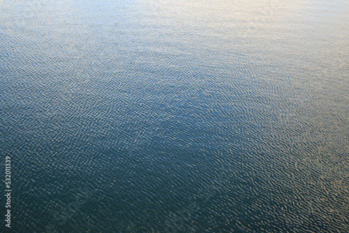 Natural wallpaper, water surface with small ripples.