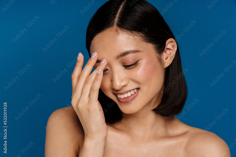Young beautiful smiling happy asian woman with closed eyes Young beautiful smiling happy asian woman with closed eyes