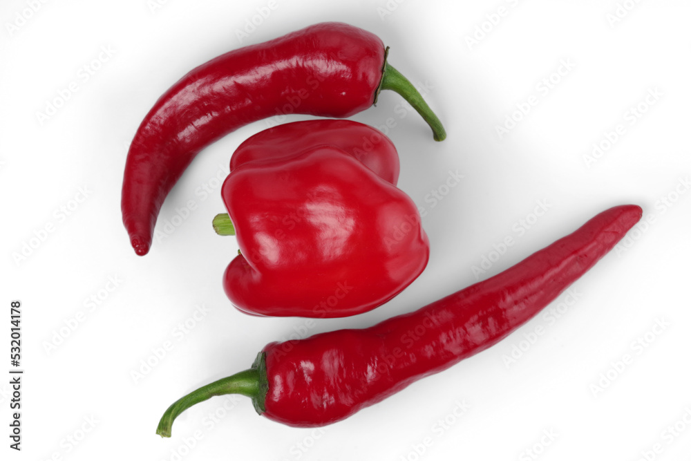 Two types of red pepper - bell pepper and chile pepper. Isolated on white background.