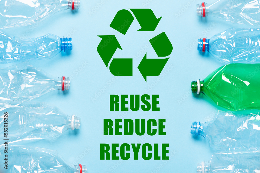 Recycling symbol with reuse reduce recycle words and plastic bottles on ...
