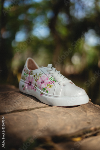 white leather shoe on natural background