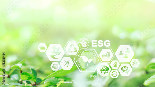 Sustainable energy and smart technology icon on blurred nature background, Environmental and Ecology concept. AI, Futuristic Smart virtual screen, Internet of things, social media, big data, metaverse