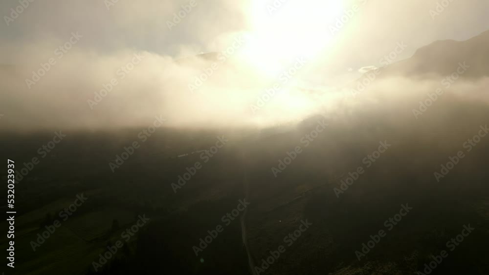 Rising above through clouds Norway mountain reveal