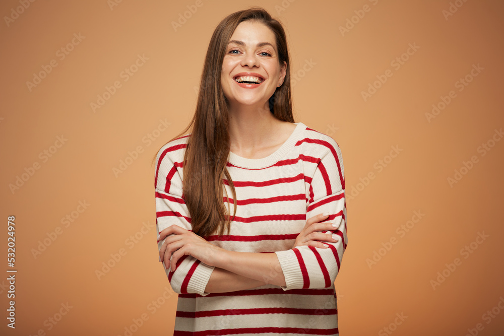 Smiling woman in casual clothes standing with arms crossed. Isolated female portrait. Smiling woman in casual clothes standing with arms crossed. Isolated female portrait.