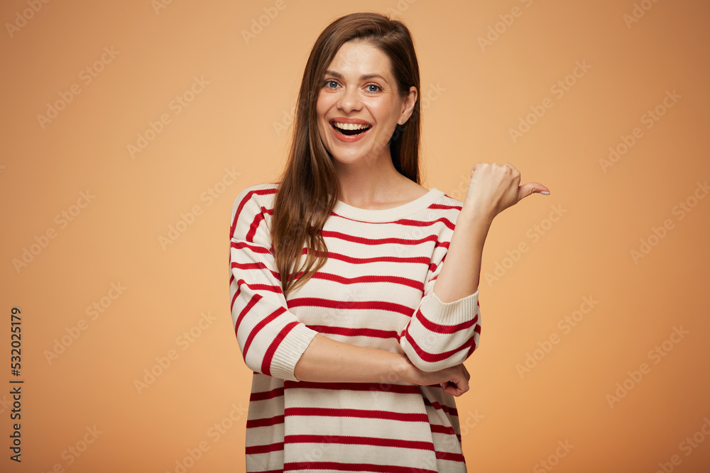 Smiling woman in casual clothes shows thumb up. Isolated female portrait. Smiling woman in casual clothes shows thumb up. Isolated female portrait.