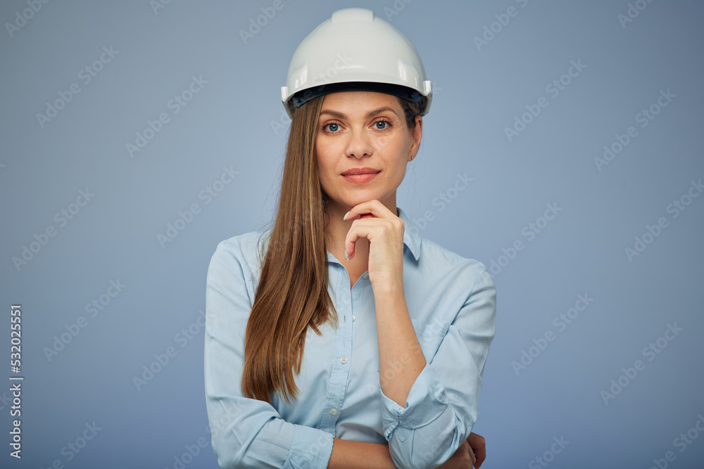 Thinking woman architect or engineer in safety industrial helmet. Isolated female portrait. Thinking woman architect or engineer in safety industrial helmet. Isolated female portrait.