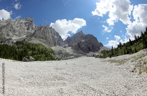 mountain scree with rocks on the dry river bed in summer photo